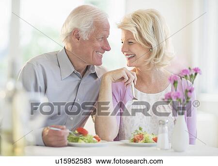 Couple enjoying healthy meal in restaurant View Large Photo Image Stock Image - Couple enjoying healthy meal in restaurant. Fotosearch