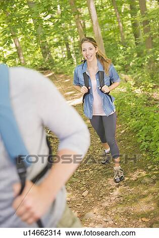 Picture - Couple hiking in forest. Fotosearch