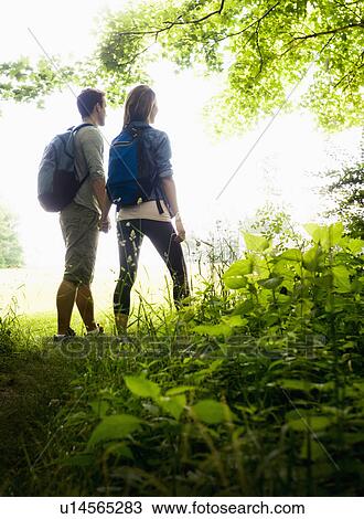 Couple hiking in forest View Large Photo Image Stock Image - Couple hiking in forest. Fotosearch