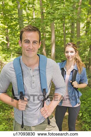 Couple hiking in forest View Large Photo Image Stock Image - Couple hiking in forest. Fotosearch