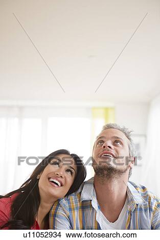 Picture - Couple looking up. Fotosearch