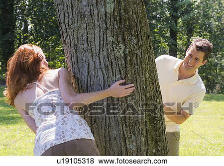Stock Photo - Couple playing in forest. Fotosearch