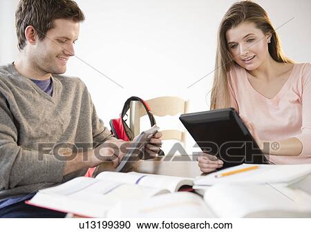 Couple studying together View Large Photo Image Stock Image - Couple studying together. Fotosearch
