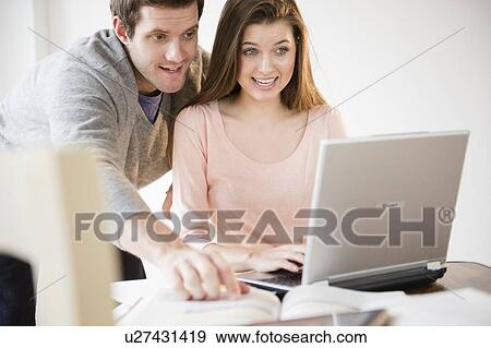 Couple studying together View Large Photo Image Stock Photo - Couple studying together. Fotosearch