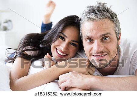 Stock Image - Couple watching television. Fotosearch