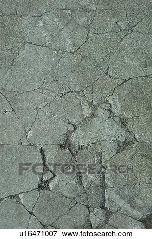 Cracked concrete View Large Photo Image Stock Photo - Cracked concrete. Fotosearch