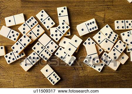 Domino tiles on wooden surface, studio shot View Large Photo Image Stock Photo - Domino tiles on wooden surface, studio shot. Fotosearch