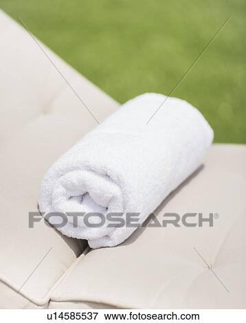 Folded towel on lounger View Large Photo Image Stock Photo - Folded towel on lounger. Fotosearch