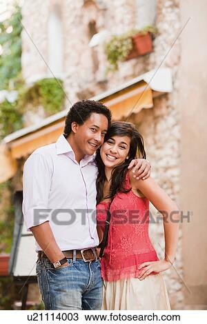 Stock Image - France, Cassis, Couple smiling and embracing. Fotosearch
