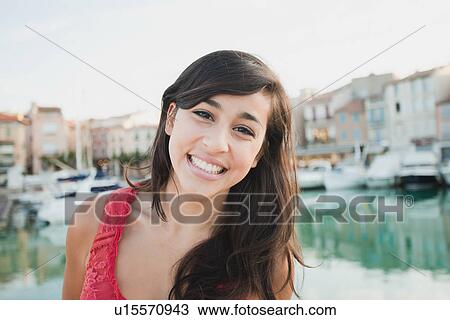 France, Cassis, Portrait of young smiling woman View Large Photo Image Stock Image - France, Cassis, Portrait of young smiling woman. Fotosearch