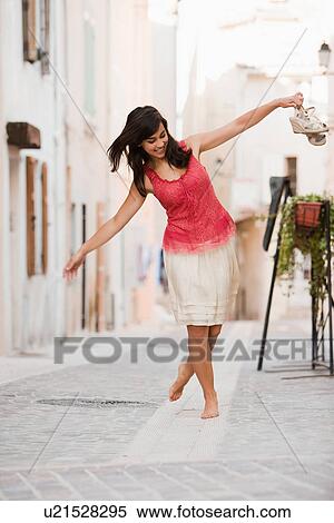 France, Cassis, Young woman balancing on curbstone View Large Photo Image Stock Photography - France, Cassis, Young woman balancing on curbstone. Fotosearch
