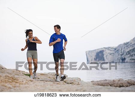 France, Marseille, Couple jogging by seaside View Large Photo Image Stock Image - France, Marseille, Couple jogging by seaside. Fotosearch