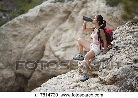 France, Marseille, Female hiker resting on rock View Large Photo Image Stock Image - France, Marseille, Female hiker resting on rock. Fotosearch