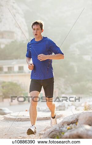 France, Marseille, Man jogging on sunny day View Large Photo Image Stock Image - France, Marseille, Man jogging on sunny day. Fotosearch