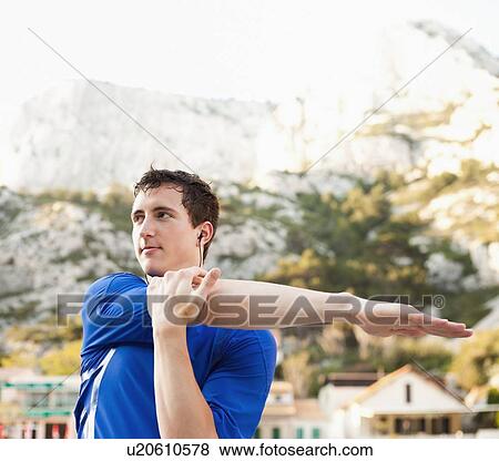 France, Marseille, Man stretching before run View Large Photo Image Stock Photo - France, Marseille, Man stretching before run. Fotosearch