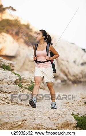 France, Marseille, Woman hiking in rocky terrain View Large Photo Image Stock Image - France, Marseille, Woman hiking in rocky terrain. Fotosearch
