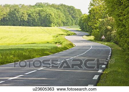 France, Rocroi, Road among green fields View Large Photo Image Stock Image - France, Rocroi, Road among green fields. Fotosearch