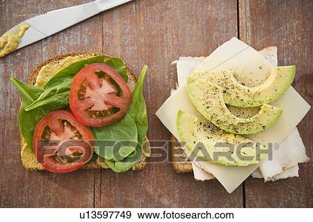 Fresh sandwiches on chopping board View Large Photo Image Stock Photo - Fresh sandwiches on chopping board. Fotosearch