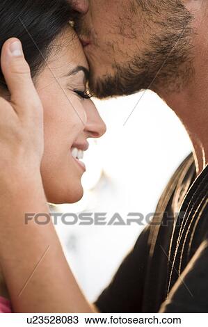Happy couple embracing View Large Photo Image Stock Image - Happy couple embracing. Fotosearch