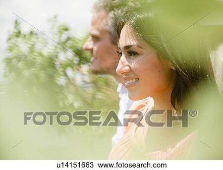 happy couple standing in bright sunshine View Large Photo Image Stock Image - happy couple standing in bright sunshine. Fotosearch