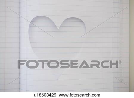 Stock Photo - Heart shape cut out of note book. Fotosearch