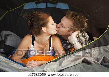 Hikers in tent kissing View Large Photo Image Stock Photo - Hikers in tent kissing. Fotosearch