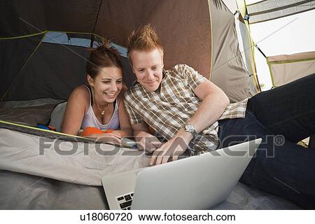 Hikers in tent using laptop View Large Photo Image Stock Image - Hikers in tent using laptop. Fotosearch