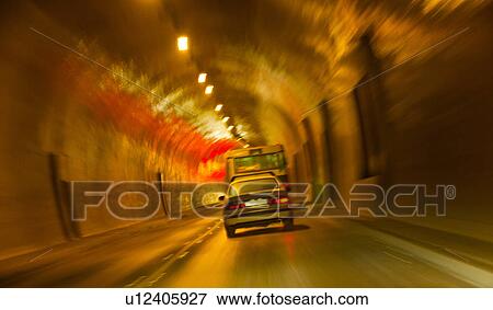 Stock Photo - Hungary, Budapest, Castle Hill, Cars driving through tunnel. Fotosearch