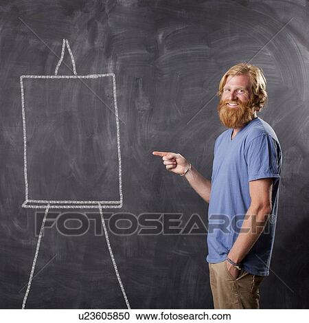 Man in front of blackboard pointing View Large Photo Image Stock Image - Man in front of blackboard pointing. Fotosearch