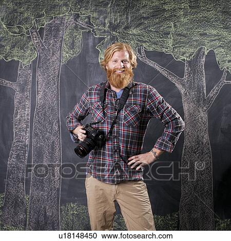 Man in front of blackboard taking pictures View Large Photo Image Stock Image - Man in front of blackboard taking pictures. Fotosearch