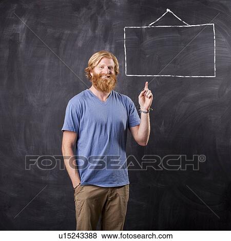 Man in front of blackboard with drawing depicting blank square View Large Photo Image Stock Photo - Man in front of blackboard with drawing depicting blank square. Fotosearch