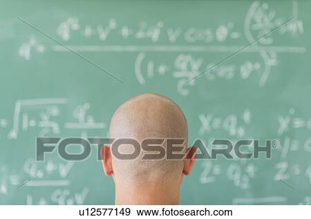 Man in front of blackboard with formulas View Large Photo Image Stock Photo - Man in front of blackboard with formulas. Fotosearch