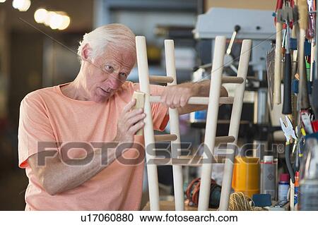 Man making stool View Large Photo Image Stock Image - Man making stool. Fotosearch