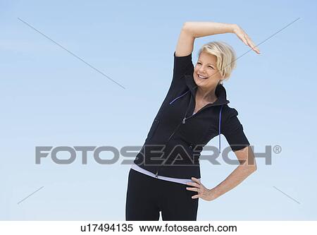 Mature woman exercising outdoors View Large Photo Image Stock Photography - Mature woman exercising outdoors. Fotosearch