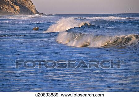 Stock Photo - Mexico, Oaxaca, Huatulco, Waves at Conejos Bay. Fotosearch