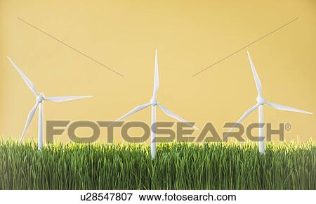 Model wind turbines in grass on yellow background View Large Photo Image Stock Photo - Model wind turbines in grass on yellow background. Fotosearch