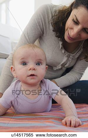 Mother and baby boy (2-5 months) posing together View Large Photo Image Stock Photography - Mother and baby boy (2-5 months) posing together. Fotosearch