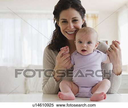 Mother and baby boy (2-5 months) posing together View Large Photo Image Stock Photography - Mother and baby boy (2-5 months) posing together. Fotosearch
