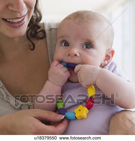 Mother and baby boy (2-5 months) playing together View Large Photo Image Stock Image - Mother and baby boy (2-5 months) playing together . Fotosearch
