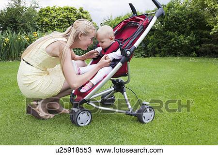 Stock Image - Mother and daughter together outdoor. Fotosearch