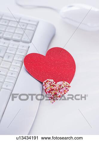 Paper hearts on computer keyboard View Large Photo Image Stock Image - Paper hearts on computer keyboard. Fotosearch