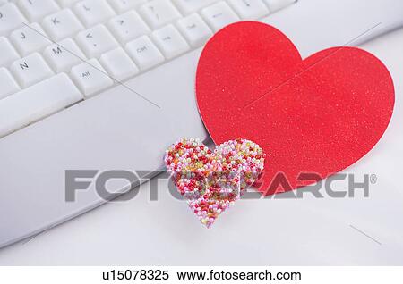 Paper hearts on computer keyboard View Large Photo Image Stock Photography - Paper hearts on computer keyboard. Fotosearch