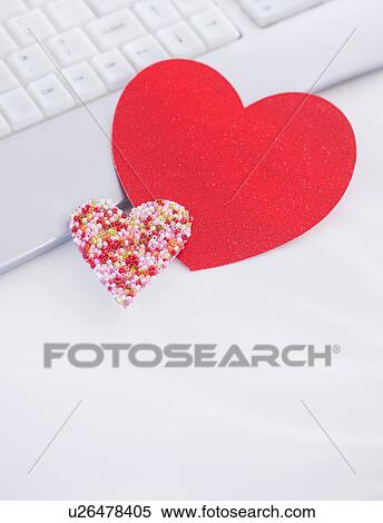 Paper hearts on computer keyboard View Large Photo Image Stock Photography - Paper hearts on computer keyboard. Fotosearch