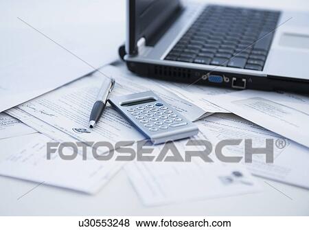 Pen, calculator and laptop View Large Photo Image Stock Photo - Pen, calculator and laptop. Fotosearch