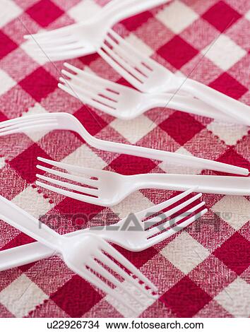 Plastic forks on checked tablecloth View Large Photo Image Picture - Plastic forks on checked tablecloth. Fotosearch