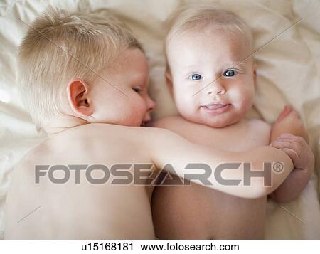 Portrait of boy (2-3) with baby sister (6-11 months) View Large Photo Image Stock Image - Portrait of boy (2-3) with baby sister (6-11 months). Fotosearch