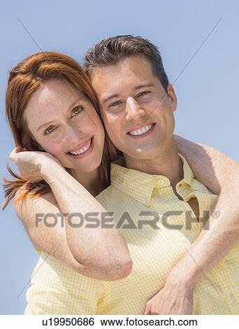 Stock Photograph - Portrait of couple smiling. Fotosearch