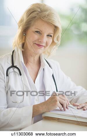 Portrait of female doctor View Large Photo Image Stock Photo - Portrait of female doctor. Fotosearch