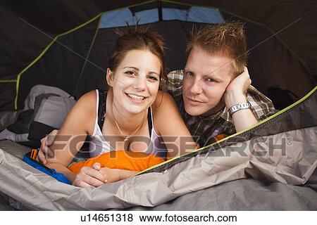 Stock Photo - Portrait of hikers in tent. Fotosearch