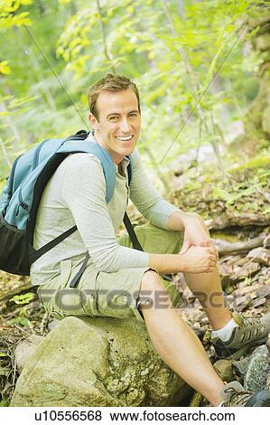 Portrait of man resting in forest View Large Photo Image Stock Photo - Portrait of man resting in forest. Fotosearch